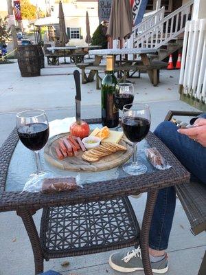 The patio and wine and cheese tray