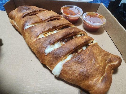 Ground Beef, Sausage, Onions, Peppers, Mushrooms and Cheese Stromboli