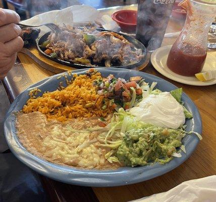 Chicken Fajitas with a lot of fixings. The salsa and chips are the best.