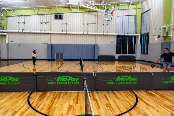 Multi-sport gymnasium set up for indoor pickleball