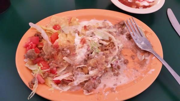 Nachos Supreme.  Notice the liquid on the bottom of the plate.