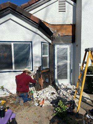 He tore out the stucco, replaced dry rotted framing, Put it all back together! My husband will paint it now!