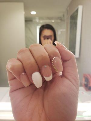 Short coffin nude with French tip and white accent nail. And some bling.