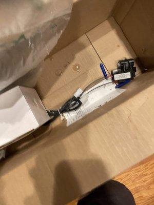 Water in box from improperly shipped pressure pump.