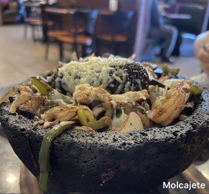 Molcajete ($19.99) Similar to how Fajitas are served. This is served piping on a hot Molcajete Bowl ** delicious **