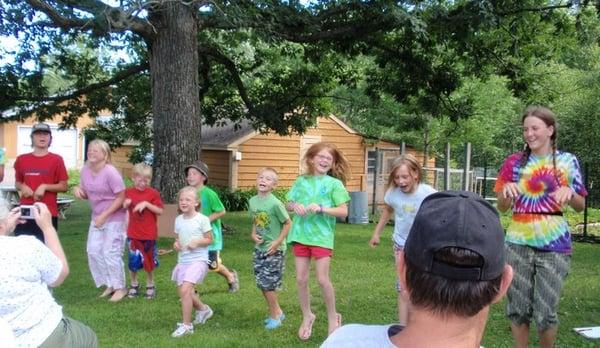 Kids at Frog and Tadpole camp showing off their frog dance during the parent presentation.