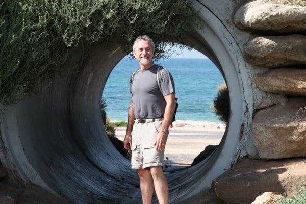 Rabbi Hylan on the beach in Old Yaffo, leading a tour in Israel.