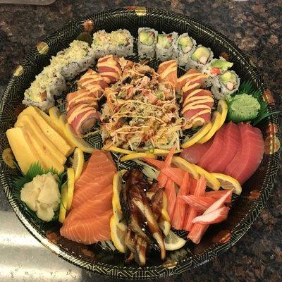 PARTY TRAY with mars rolls , bobcat roll Christmas roll & Alaskan roll ,20 pieces of sushi with sweet egg, Kani , salmon ,eel & tuna.