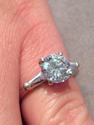 1.4 ct center stone SI, G. with 2 tapered baguettes 1.7 ct wt total set in platinum. We searched for this ring for 2 years!!!