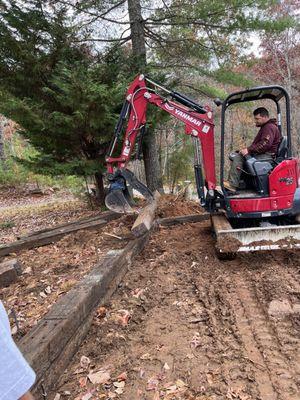 Building a back out of railroad ties to hold the gravel for the parking pad/ turn around.