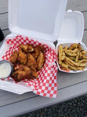 Honey Old Bay wings and pickle fries. Wings were awesome