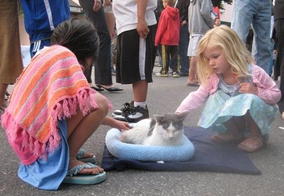 Boynton at a pet faire greeting kids.