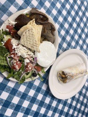 Delicious traditional yero platter with greek salad, tzatziki & yukon potatoes and a chicken shawarma sandwich