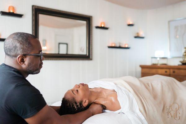 Owner and primary therapist, Curtis releases tension from a client's shoulders during a #deeptissuemassage.