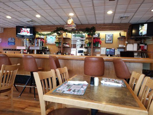 Dining in the bar area includes 2 person booths along the window wall. Restairant also offers a separate dining room.