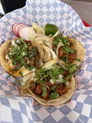 Two Al Pastor and one Choriqueso Taco