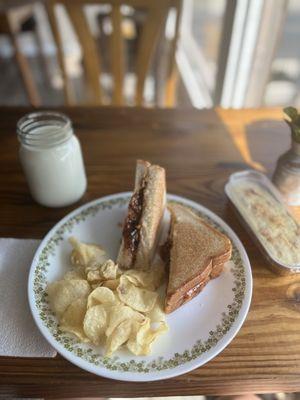 Glass of milk, the Texan w/strawberry jalapeño & complementary kettle chips, banana pudding