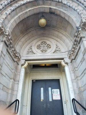 Pineapples are carved into the entry, fitting since they traditionally represent hospitality and greetings into the building.