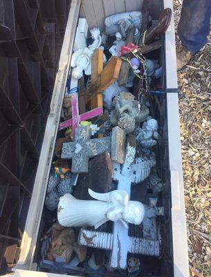 Crosses and angel statues that were on graves and are now throw away and broken