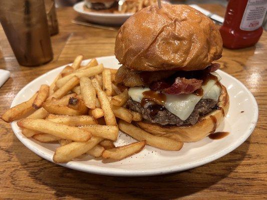 The Happy Jack burger (Monterey Jack, Bacon, Onion Rings, BBQ Sauce), came with fries