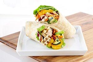 MANDARIN CHICKEN WRAP: Spring mix, all-natural chicken, mandarin oranges, cucumbers, carrots, dried cranberries, & chow mein noodles.