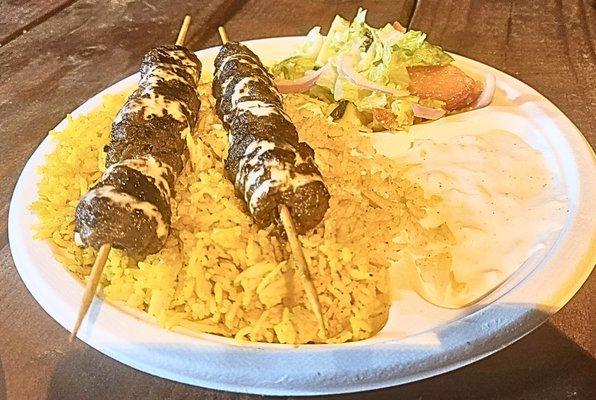 Kebab over rice w/side salad and tatziki sauce