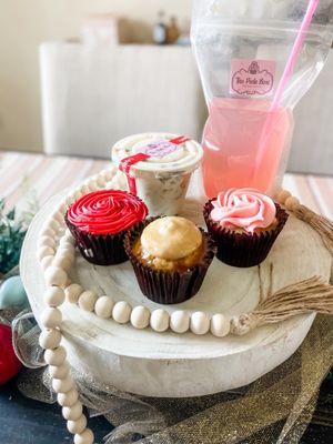 Cupcakes- Strawberry (red icing), Carmel (ivory icing) & signature cupcake (pink icing), banana pudding & homemade pink lemonade !