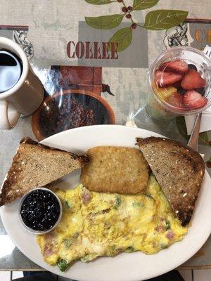 Another fabulous breakfast.  Western omelette, whole wheat toast with grape jelly, potato, fruit cup and coffee.