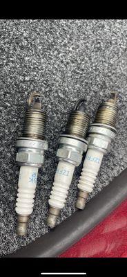 pictures of the old spark plugs pulled out from the second boat shop to prove it was never changed.