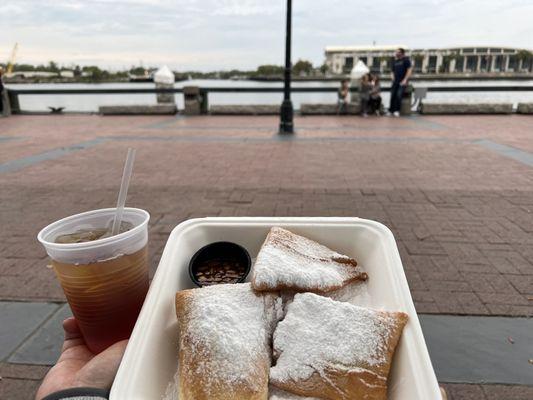 Beignets and a sweet tea to-go, with a view of the River