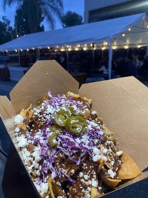 Mole Nachos - fresh made tortilla chips , mole negro , crispy chicken , red cabbage , Queso fresco , jalapeño's