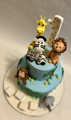 2-tiered jungle themed cake with edible figurines