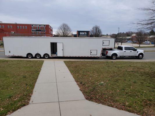 One of our moving trucks and trailers,  we also haul cars.