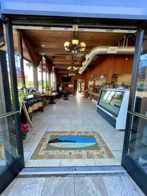 Lovely coffee shop with a beautiful tile mural on the floor!