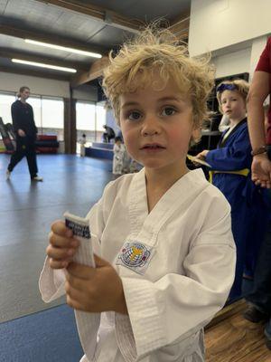 First stripe in his white belt