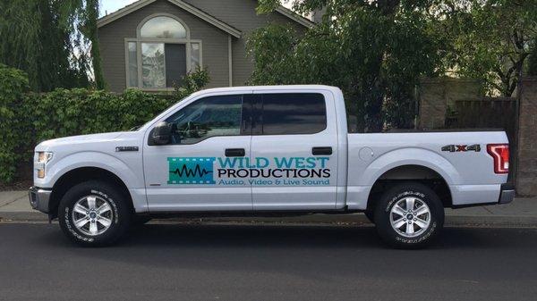 Wild West Productions company truck with logo and contact info, printed and attached by Fast Signs