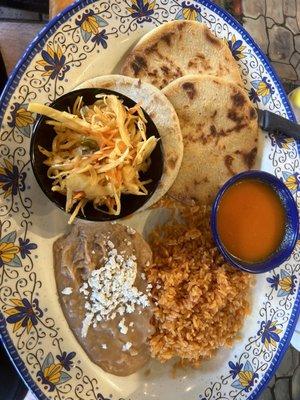 Pupusas, cabbage, tomato sauce, rice, beans.