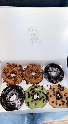 Half a dozen donuts  pictured is pecan,mint,cookies and cream, and peanut butter