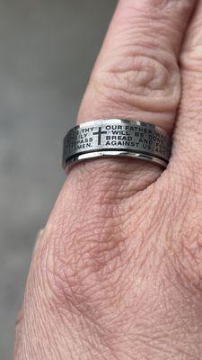 I bought my husband and I a spinning ring with the Our Father written all around it.