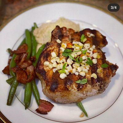 Pork chop. Chili-crusted, with a spicy corn puree. Medium-well. Came with a small wheelbarrow to carry around in. HUGE