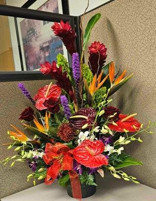 Beautiful tropical flowers arrangement with 3 red roses!