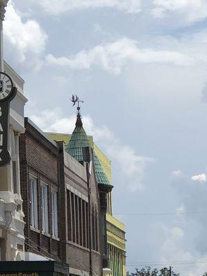 The downtown weathervane showing a witch and moon