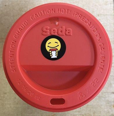 Happy stickers go on every cup.