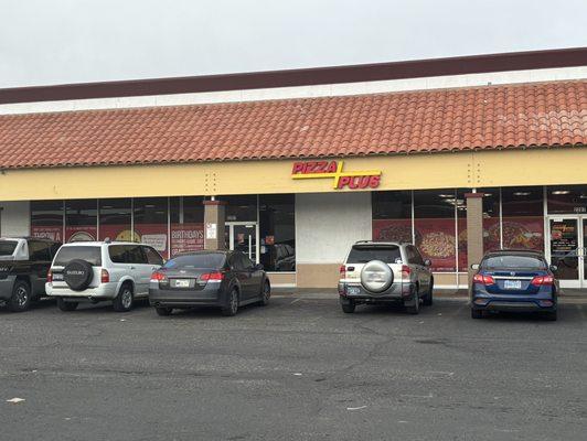 Store front to Pizza Plus, Oddie Blvd location.