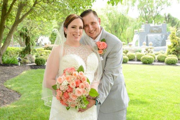 Jennifer ,our bride and groom at Celebrations in Bensalem, Peaches and Coral hand held bouquet