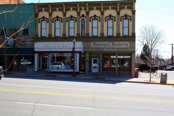 Benny's Bakery is right next door to the Calico Cat Bookstore.