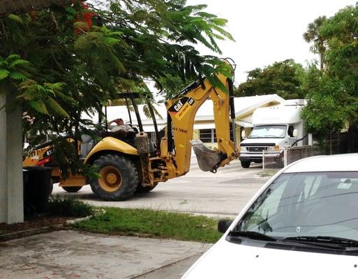 Nap time for the Arrow Asphalt backhoe driver.  yes in someone's driveway!