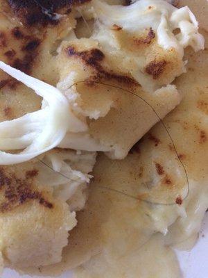 Disgusting hair in my pupusas. Yuck will never eat here again.