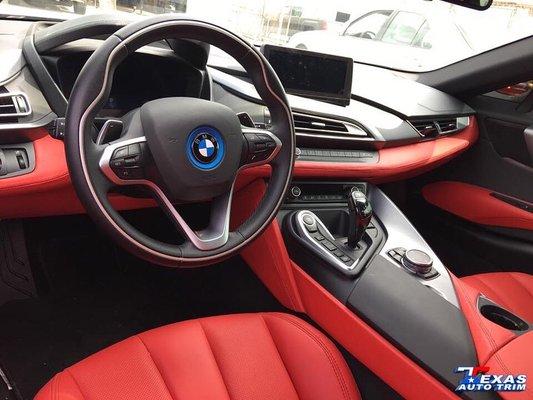 Red leather seats, center console, dash, and door panels completed on a BMW i8.