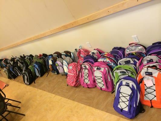 Giveaway backpacks for the kids!  Stuffed full of school goodies too!